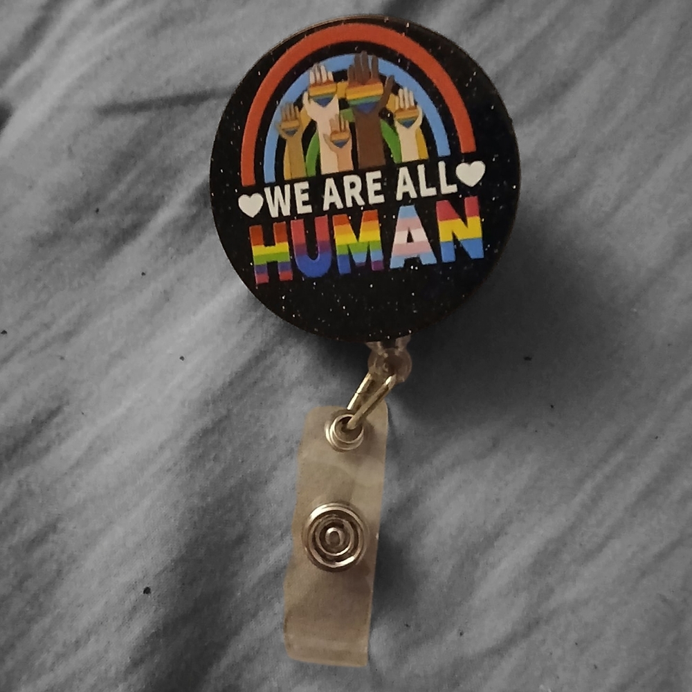 "We Are All Human" Retractable Badge Clip